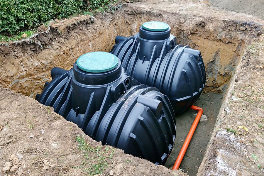 Septic Haulers and Installers - Two Plastic Underground Storage Tanks Placed Below Ground for Harvesting Rainwater
